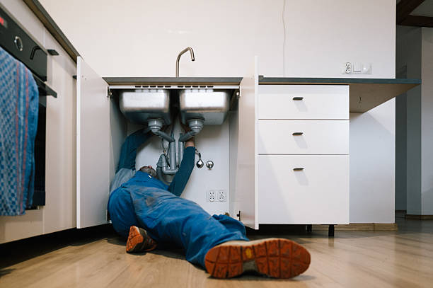 Professional Emergency Plumber technician working in Milan, MO
